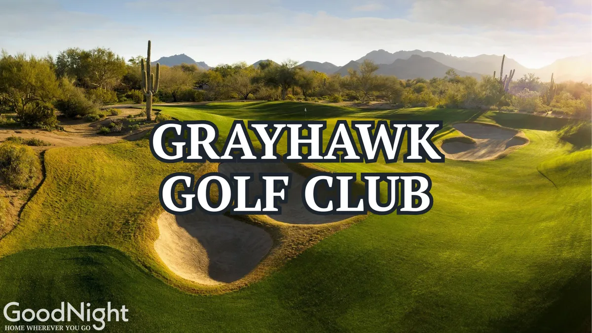 A sweeping view of a lush golf course dotted with sand traps, surrounded by native cacti and set against a backdrop of distant mountains. The image captures a classic Scottsdale golf landscape in the golden light of late afternoon.